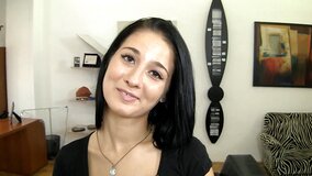 A hot brunette is making a casting video in the office