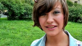 A brunette shows her natural tits and puffy nipples outside