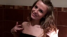 Slender amateur sucks two dicks for cash in the public toilet