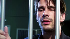 A raven haired girl is getting fucked hard in a cell in the prison